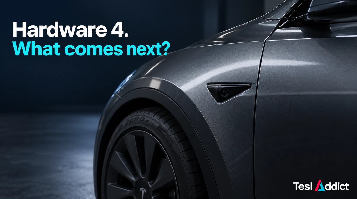 Close-up of a graphite vehicle side camera with the words Hardware 4. What comes next?