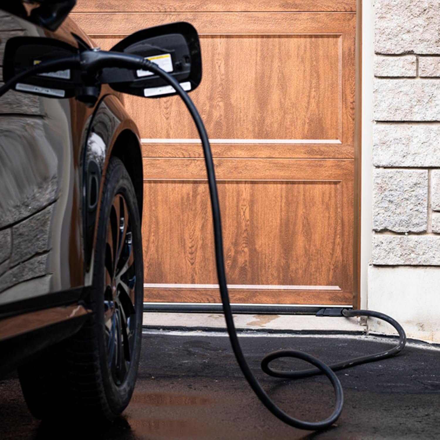 UNDOR Garage Door Protector for EV Charging Cables Tesla owners and EV drivers who regularly run charging cables under a garage door and want a cleaner, safer, and more weather-resistant charging setup.